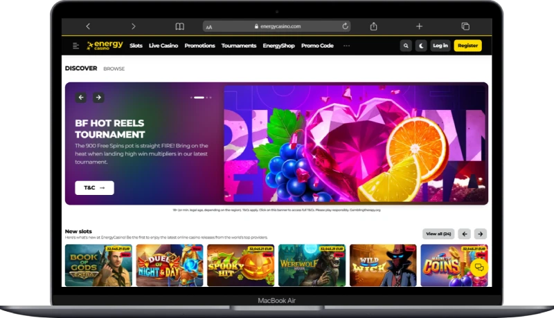 Laptop som visar Energy Casino hemsida med slots och välkomsterbjudanden för svenska spelare